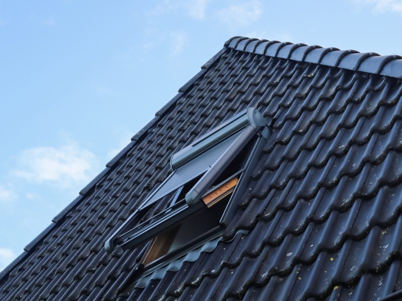 Open,Roof,Window,In,Velux,Style,With,Black,Roof,Tiles