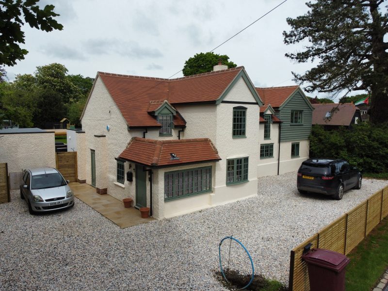 View of a large house with cement grey windows